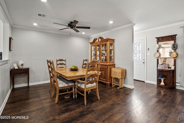 dining room with ceiling fan, ornamental molding, and dark hardwood / wood-style floors