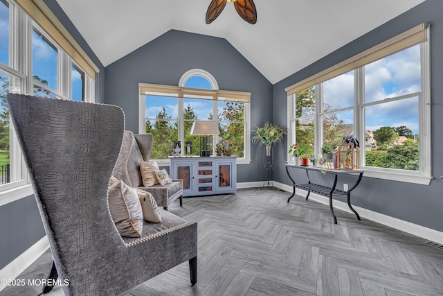 interior space with ceiling fan, parquet floors, and lofted ceiling