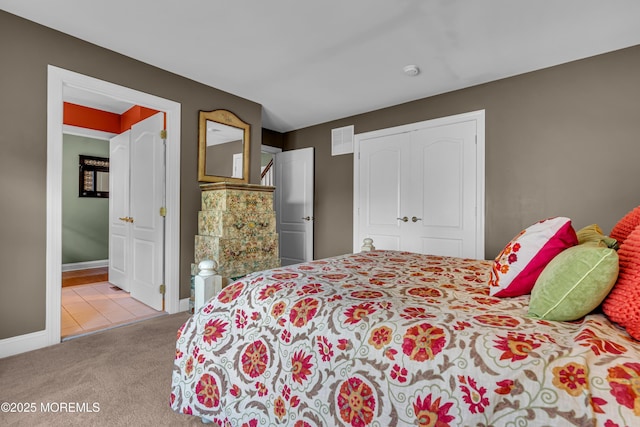 carpeted bedroom with a closet