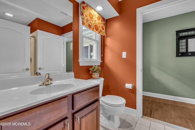 bathroom with tile patterned floors, vanity, and toilet