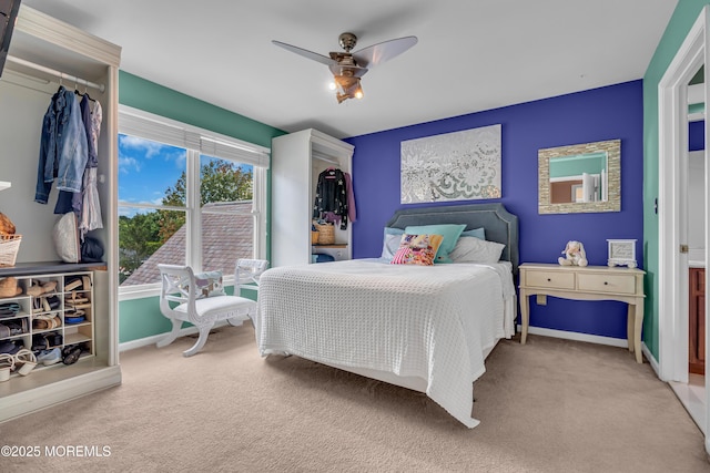 bedroom featuring ceiling fan and light colored carpet