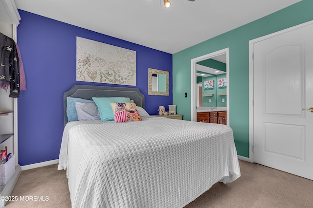 carpeted bedroom featuring ensuite bathroom