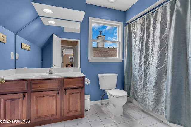 bathroom with vanity, vaulted ceiling, toilet, and tile patterned flooring