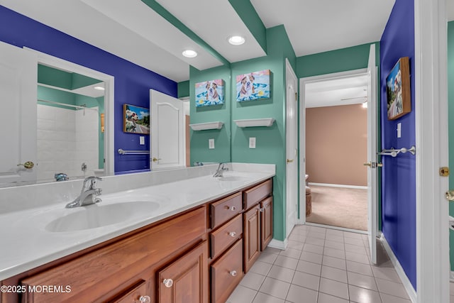 bathroom with vanity, toilet, walk in shower, and tile patterned floors