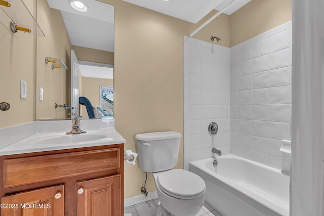 full bathroom with tiled shower / bath combo, toilet, tile patterned flooring, and vanity