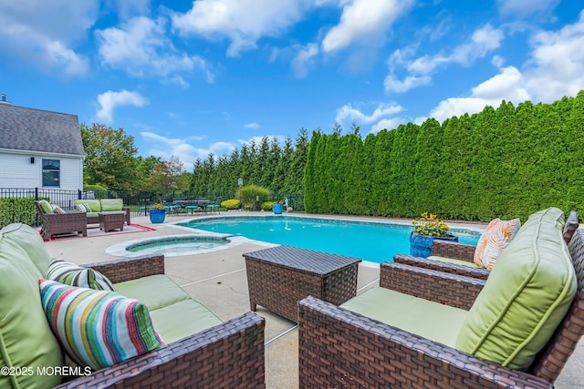 view of swimming pool with an in ground hot tub, a patio, and an outdoor hangout area