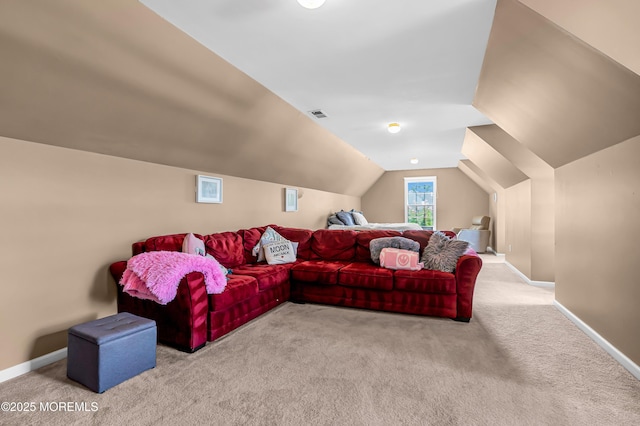 carpeted living room featuring lofted ceiling