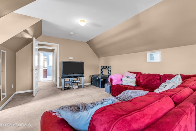 carpeted living room with vaulted ceiling