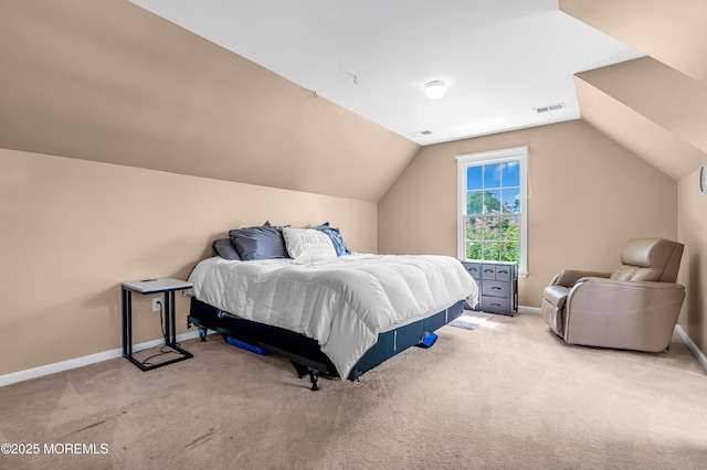 bedroom with light carpet and vaulted ceiling