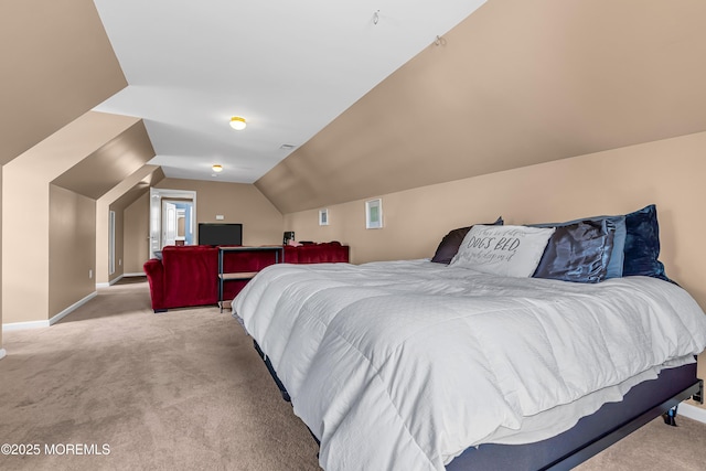 carpeted bedroom featuring vaulted ceiling