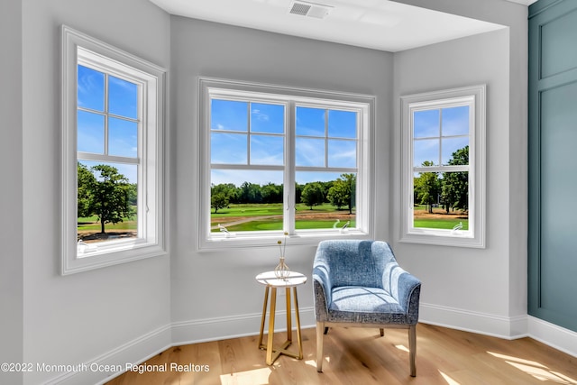 sitting room with light hardwood / wood-style flooring