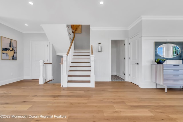 interior space featuring hardwood / wood-style floors and ornamental molding