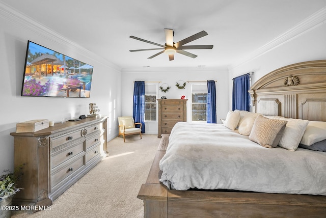 carpeted bedroom featuring crown molding and ceiling fan