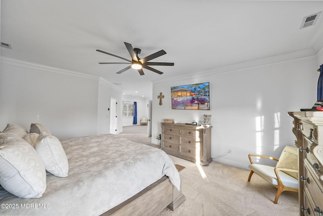 bedroom featuring ornamental molding, light carpet, and ceiling fan