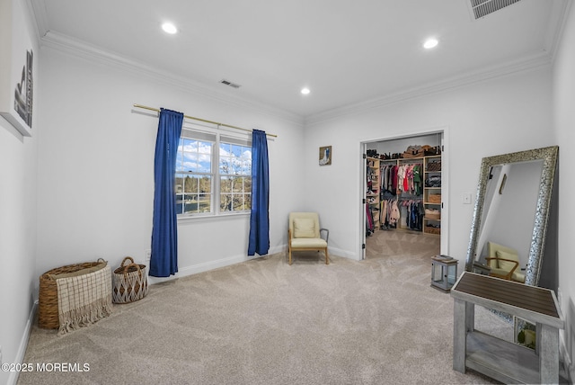 living area with ornamental molding and light colored carpet