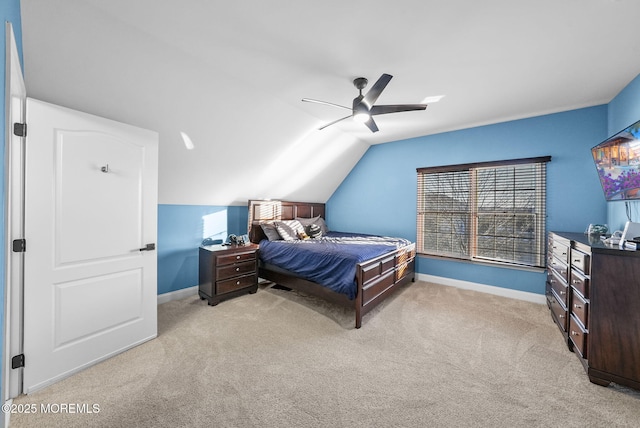 carpeted bedroom featuring vaulted ceiling and ceiling fan