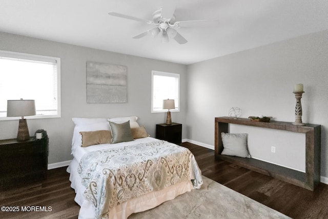 bedroom with ceiling fan and dark hardwood / wood-style floors