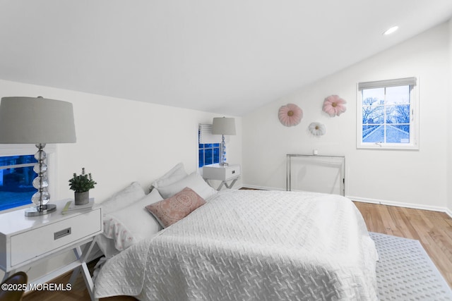 bedroom featuring vaulted ceiling and hardwood / wood-style floors