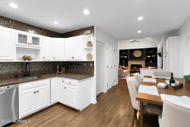 kitchen featuring white cabinetry, dishwasher, sink, and dark wood-type flooring