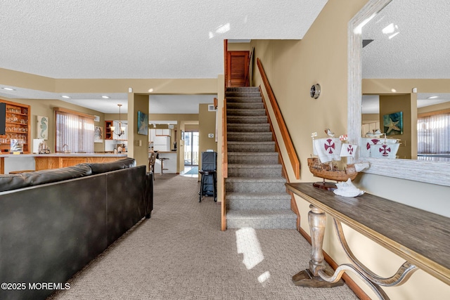 interior space with carpet floors and a textured ceiling