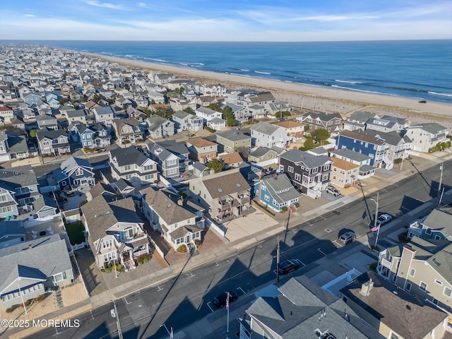 aerial view featuring a water view and a view of the beach