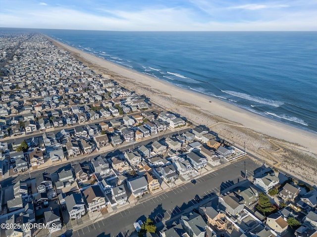 bird's eye view with a beach view and a water view