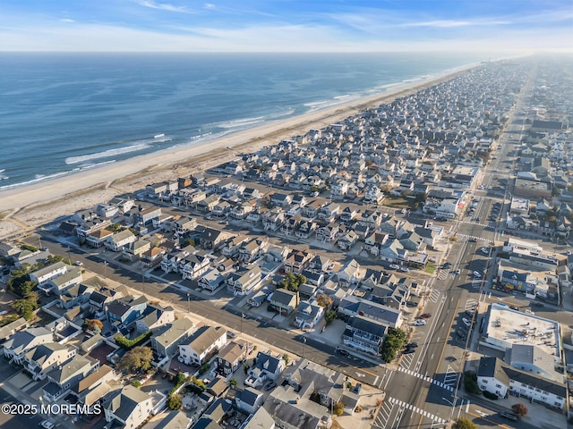 aerial view with a water view and a view of the beach