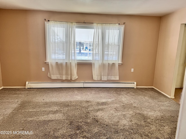 unfurnished room with carpet floors and a baseboard heating unit