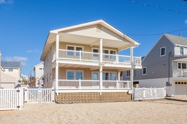 view of front of property featuring a balcony and covered porch