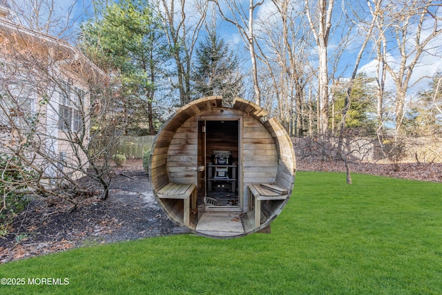 view of outdoor structure with a lawn