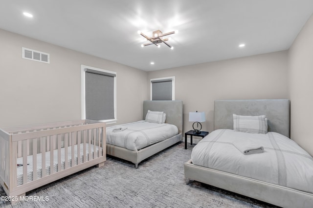 bedroom with a notable chandelier