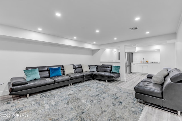 living room with light hardwood / wood-style floors