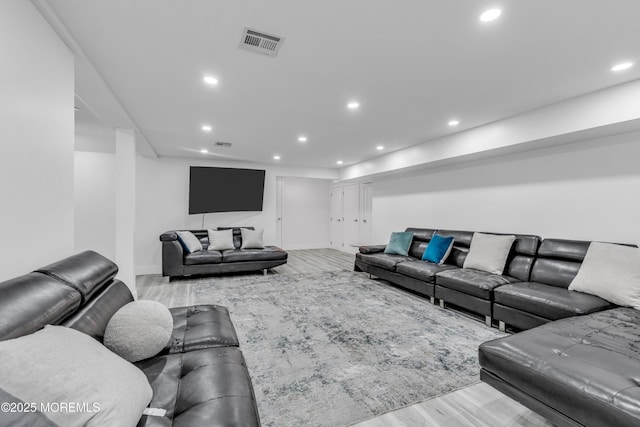 living room with light hardwood / wood-style flooring