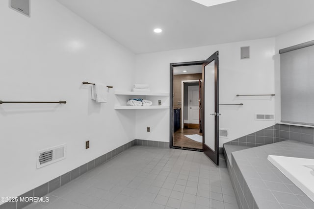 bathroom with tile patterned flooring