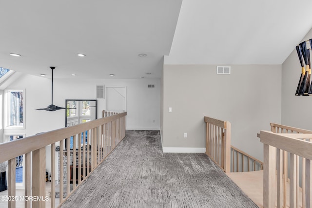 hallway featuring carpet