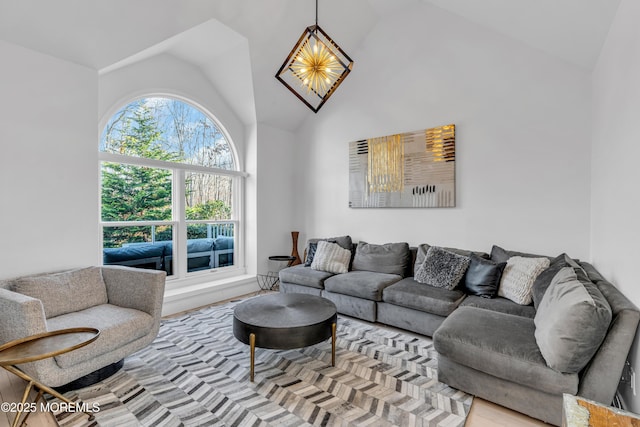 living room featuring light hardwood / wood-style floors and lofted ceiling