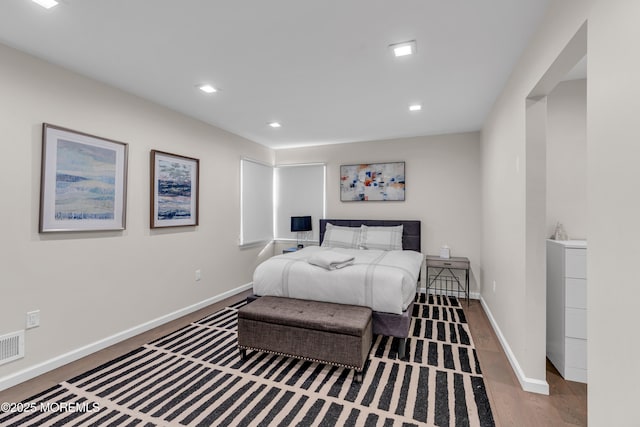 bedroom with hardwood / wood-style floors