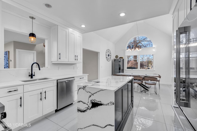 kitchen with sink, pendant lighting, white cabinetry, and stainless steel appliances