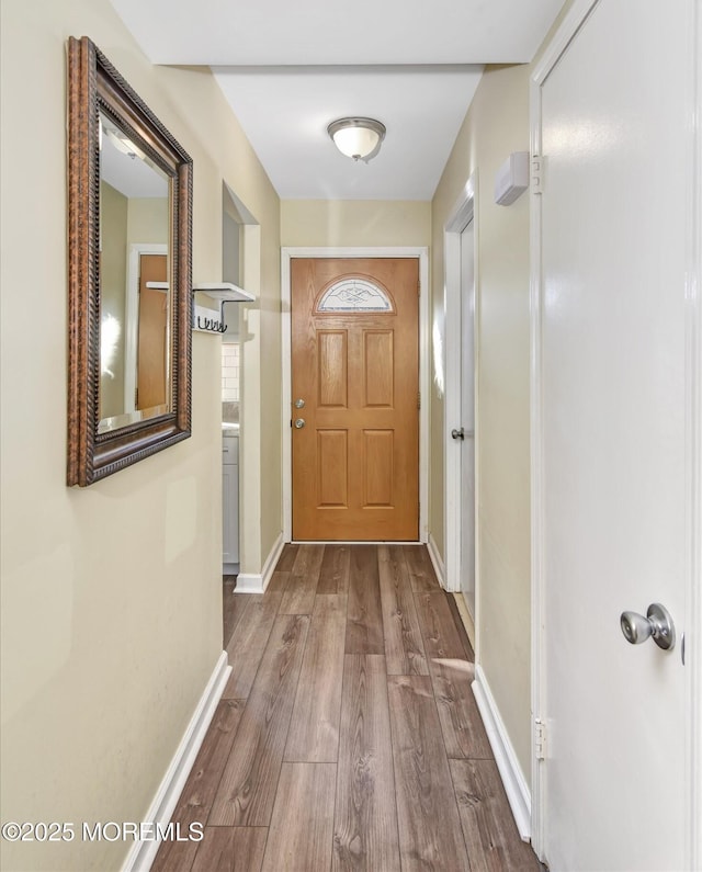 doorway with hardwood / wood-style floors