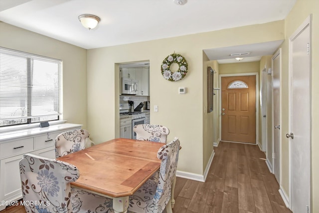 dining room featuring dark wood-type flooring