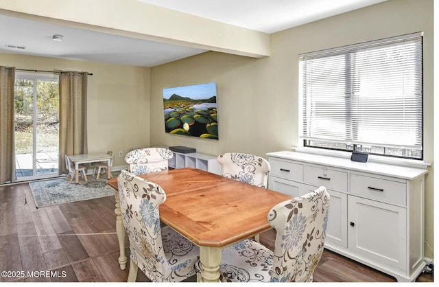 dining space with dark wood-type flooring