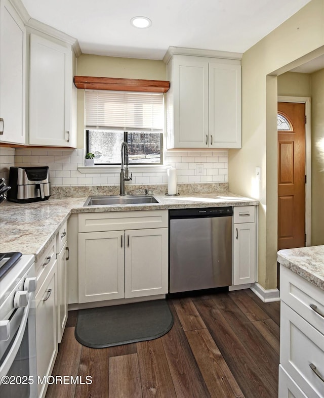 kitchen with white gas range, dishwasher, sink, and white cabinets