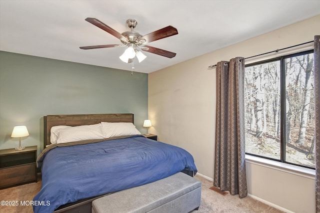 bedroom with light carpet and ceiling fan