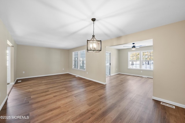 15B Betsy Ross Dr Unit B, Monroe, NJ 08831 - unfurnished room featuring an inviting chandelier and dark hardwood / wood-style flooring