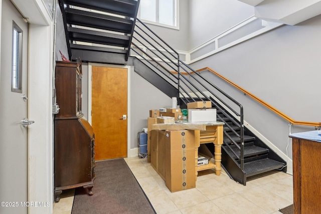 stairway featuring tile patterned floors