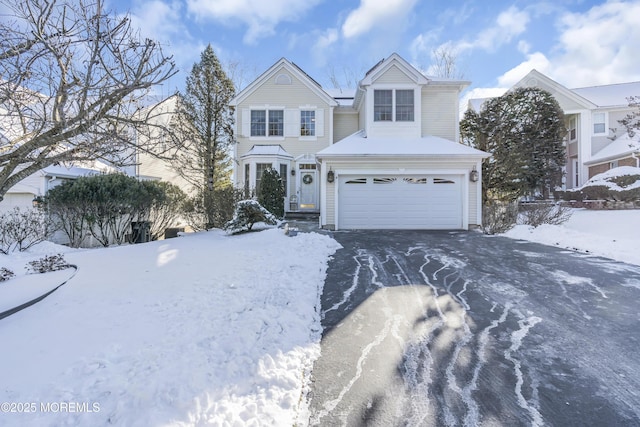 front of property with a garage