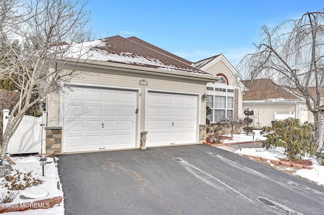 single story home featuring a garage