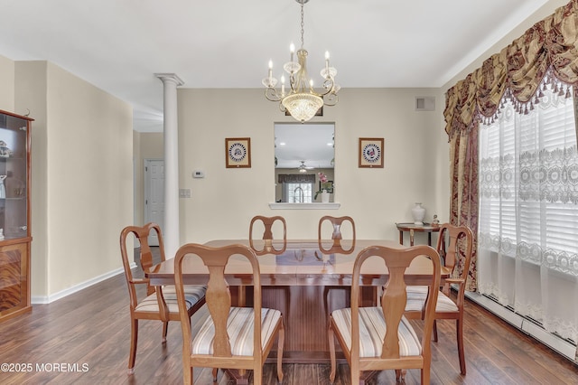 dining area featuring baseboard heating, dark hardwood / wood-style flooring, and a healthy amount of sunlight