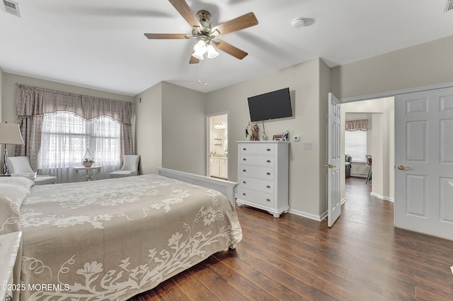 bedroom with ceiling fan, ensuite bathroom, and dark hardwood / wood-style flooring