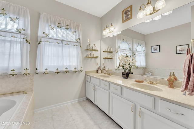 bathroom featuring vanity, tiled tub, and tile patterned floors